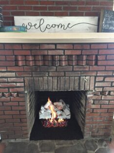 installed aspen timbers, vented, natural gas log set, into wood burning fireplace