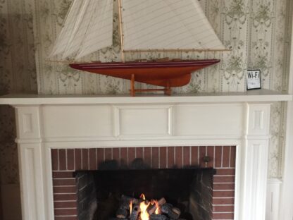 cross timbers log set into wood burning fireplace