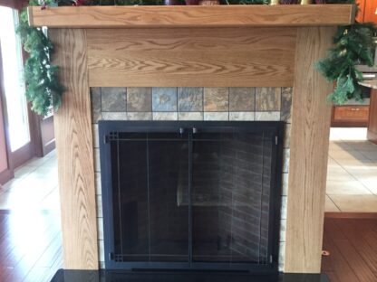 custom made all steel glass fireplace doors, with gate mesh screen, on Rumford wood burning masonry fireplace.